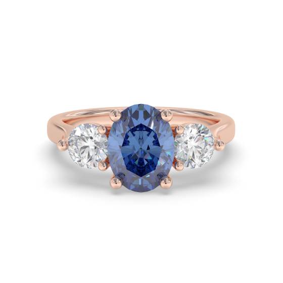 0,70 ct ovaler blauer Saphir und Diamant-Trilogie-Ring