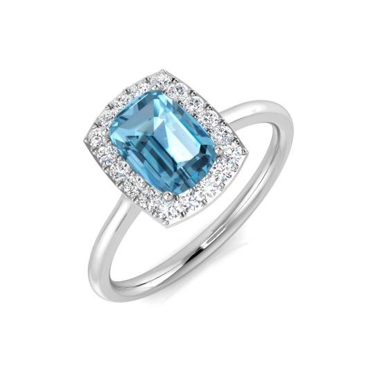 Ring mit blauem Topas im Kissen-Design und rundem Diamanten im Halo-Design