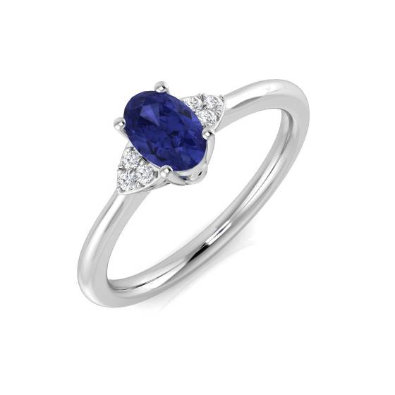 0,55 ct VS/E-F Ovaler Tansanit und runder Diamant Trilogie-Ring