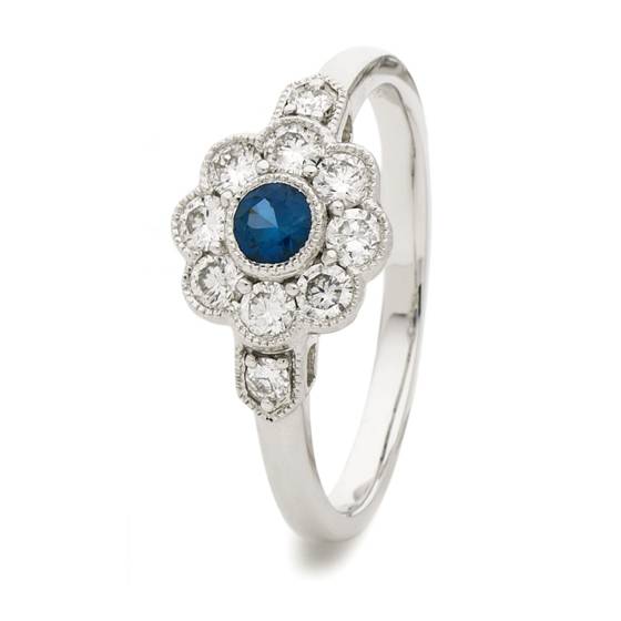 Ring mit blauem Saphir (0,60 ct) und Diamant-Halo