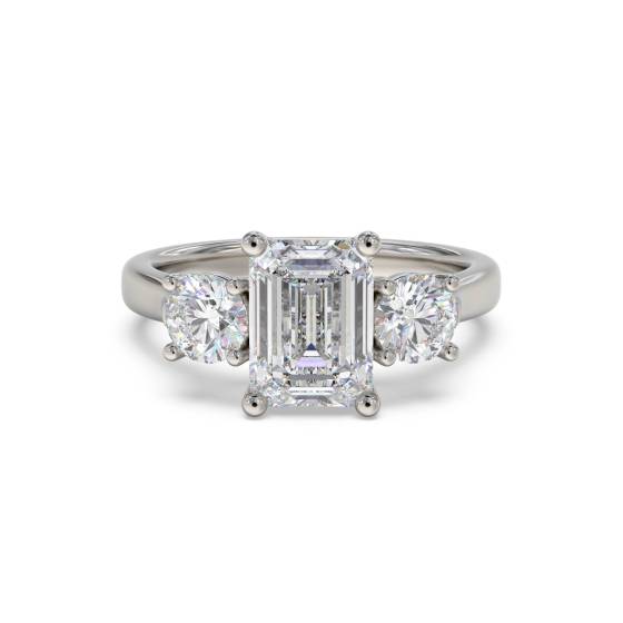 Klassischer Trilogie-Ring mit Smaragd und rundem Diamanten