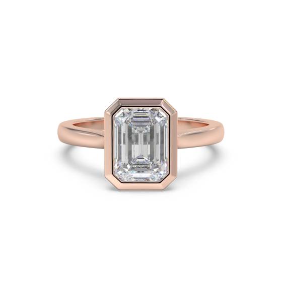 Eleganter Verlobungsring mit Smaragd und Diamanten in Lünettenfassung