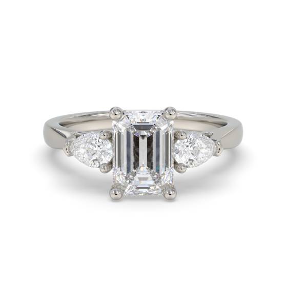 Eleganter Trilogie-Ring aus Smaragd und Birnendiamant