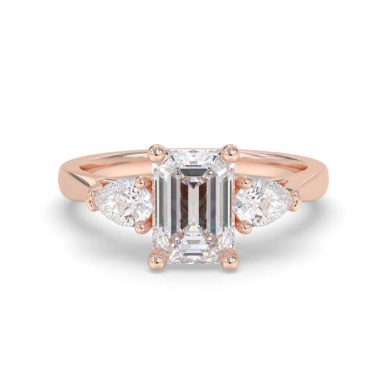 Eleganter Trilogie-Ring aus Smaragd und Birnendiamant