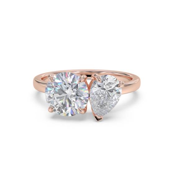 Zweistein-Diamantring mit rundem und birnenförmigem Schliff