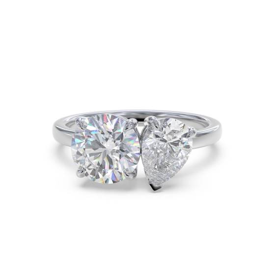 Zweistein-Diamantring mit rundem und birnenförmigem Schliff