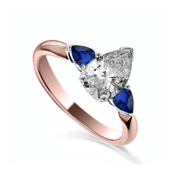 Dreiteiliger Ring mit Birnendiamant und blauem Saphir

