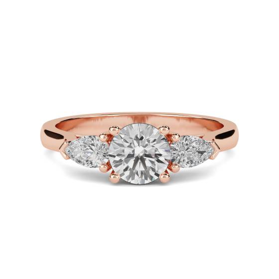 Eleganter Trilogie-Ring mit runden und birnenförmigen Diamanten