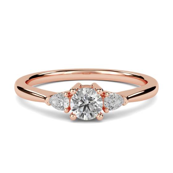 Eleganter Trilogie-Ring mit runden und birnenförmigen Diamanten