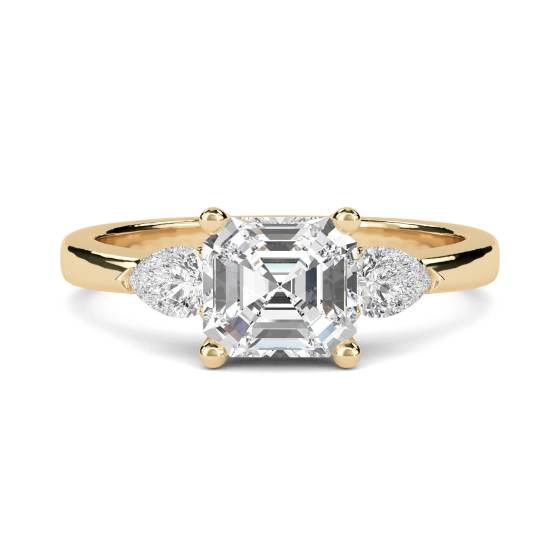 Eleganter Trilogie-Ring aus Asscher- und Birnenschliff-Diamanten